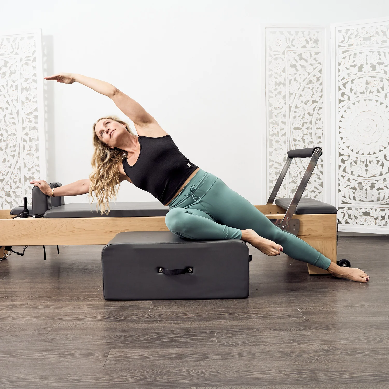 Pilates movement demonstrated on a reformer